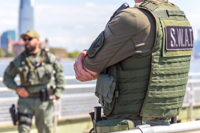 equipped swat soldier standing on a pier in New York