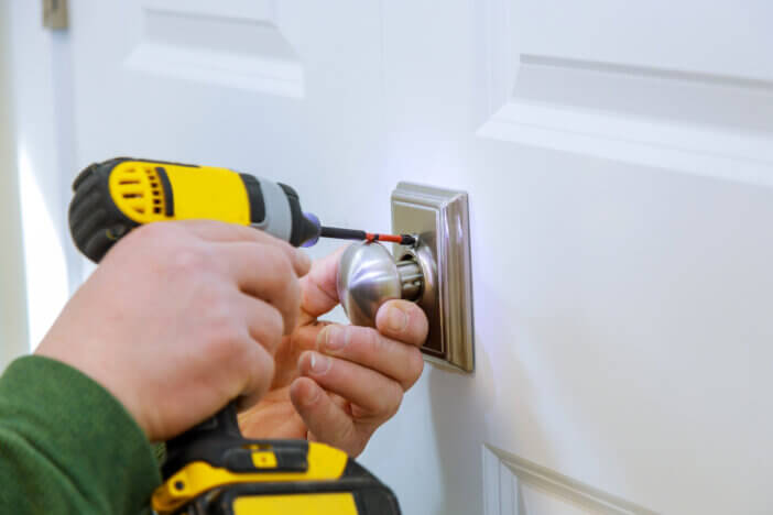 Locksmith install the door new dummy lock in house.