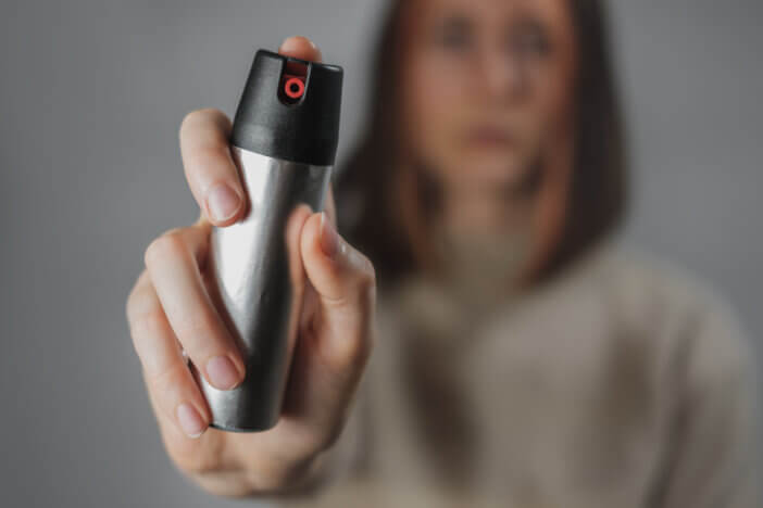 Self defence or prevention of home violence concept: using tear gas to defend yourself