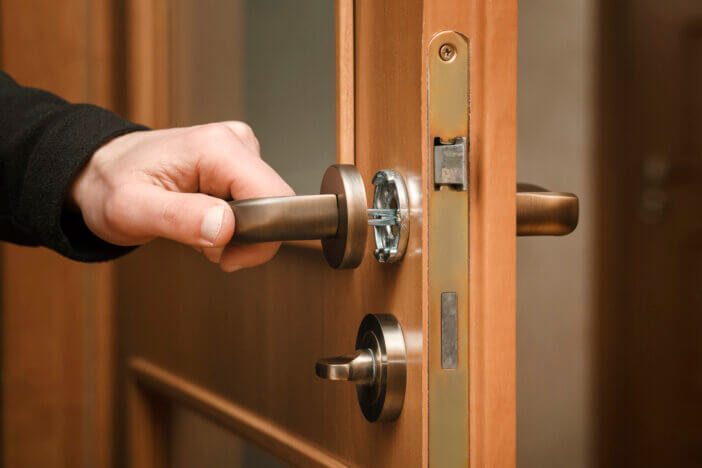 Door handle installing. Fixing door lock master.