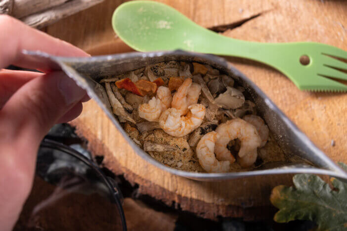 Freeze-dried food in a bag. Dried peeled shrimp. Top.