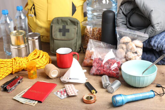Disaster supply kit for earthquake on wooden table