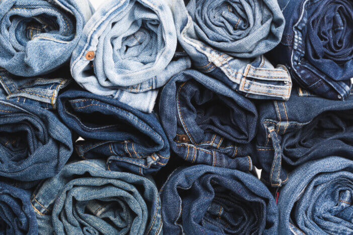 Blue jean background .Blue denim jeans texture. Jeans background. Blue torn denim jeans texture.classic nature tone jean.denim jeans texture background with frayed hole, black fabric grunge background