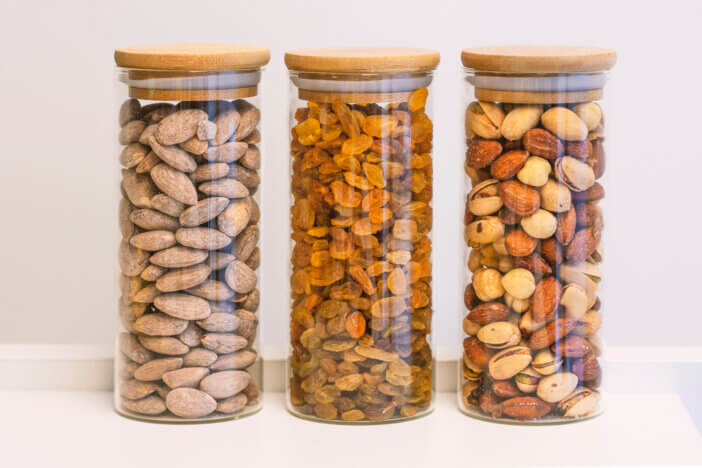 Healthy nuts in the bottle isolated on white
