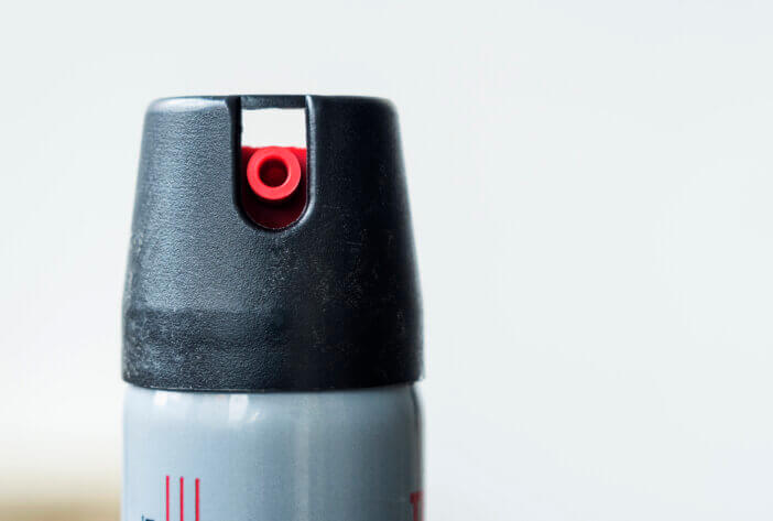 Tear gas or pepper spray for personal safety and defense.