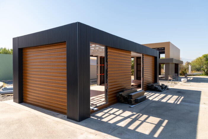 Newly built metal framed building with siding. Construction of a new tiny house. selective focus