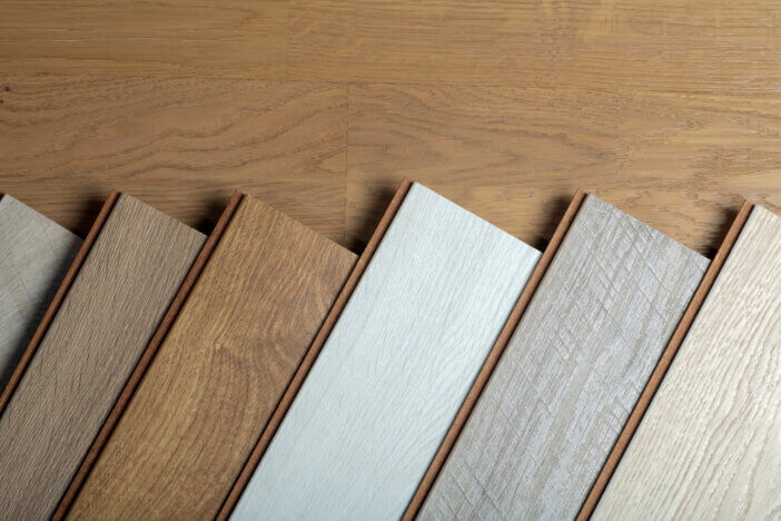 Laminate background. Samples of laminate or parquet with a pattern and wood texture for flooring and interior design. Production of wooden floors..