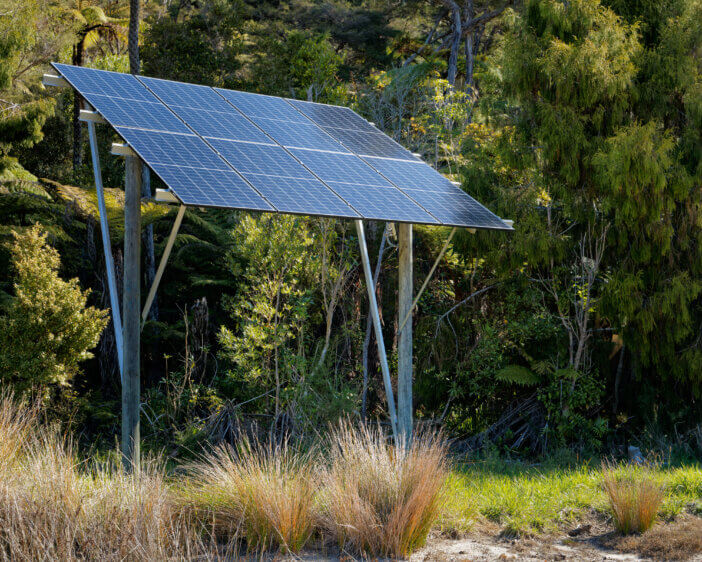 Living off the grid. Solar panels providing electricity to an off grid house in New Zealand's back country.