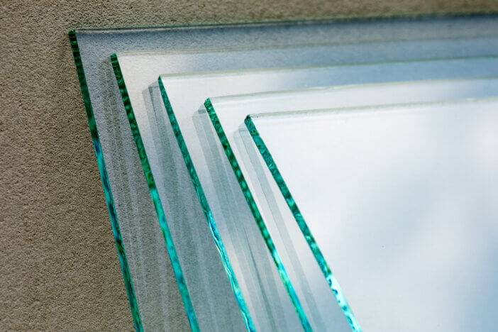 Sheets of Factory manufacturing tempered clear float glass panels cut to size.