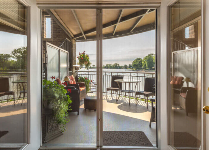 Inside view overlooking balcony and lake