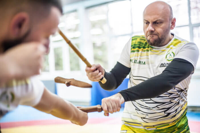 Plovdiv, Bulgaria - December 15, 2018: Stick and knife together fighting techniques training. Kapap instructor Igor Sucevic teaches his students on AVI NARDIA KAPAP SELF DEFENSE SEMINAR