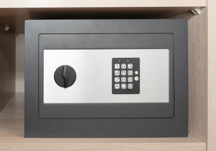 a small digital safe on a shelf in the closet. Safe at home or hotel