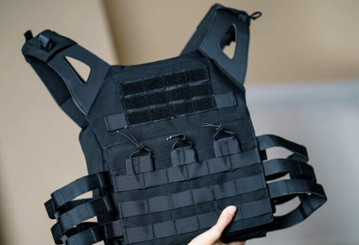 Body armor suit, Bulletproof vest for protection from bullets in the hand.